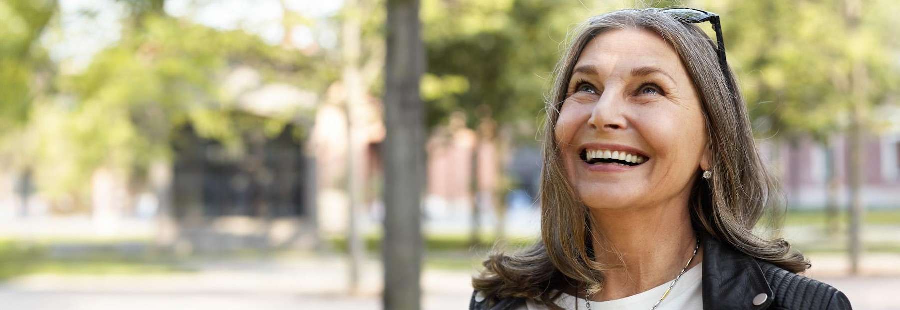 Woman in Fayetteville laughing with her dental implant