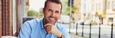 A man smiling after getting professional teeth whitening in Fayetteville, AR