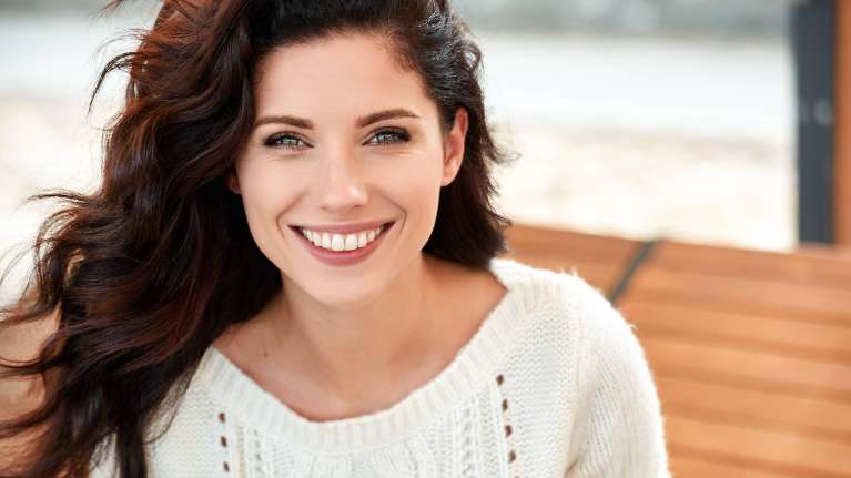 Happy woman smiling comfortably with dental BOTOX in Fayetteville AR
