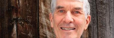 A elderly man smiling after a Dental Exam in Fayetteville, AR