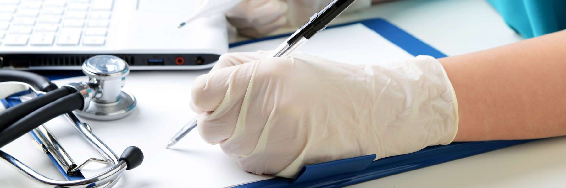 Our Fayetteville Dentist taking notes