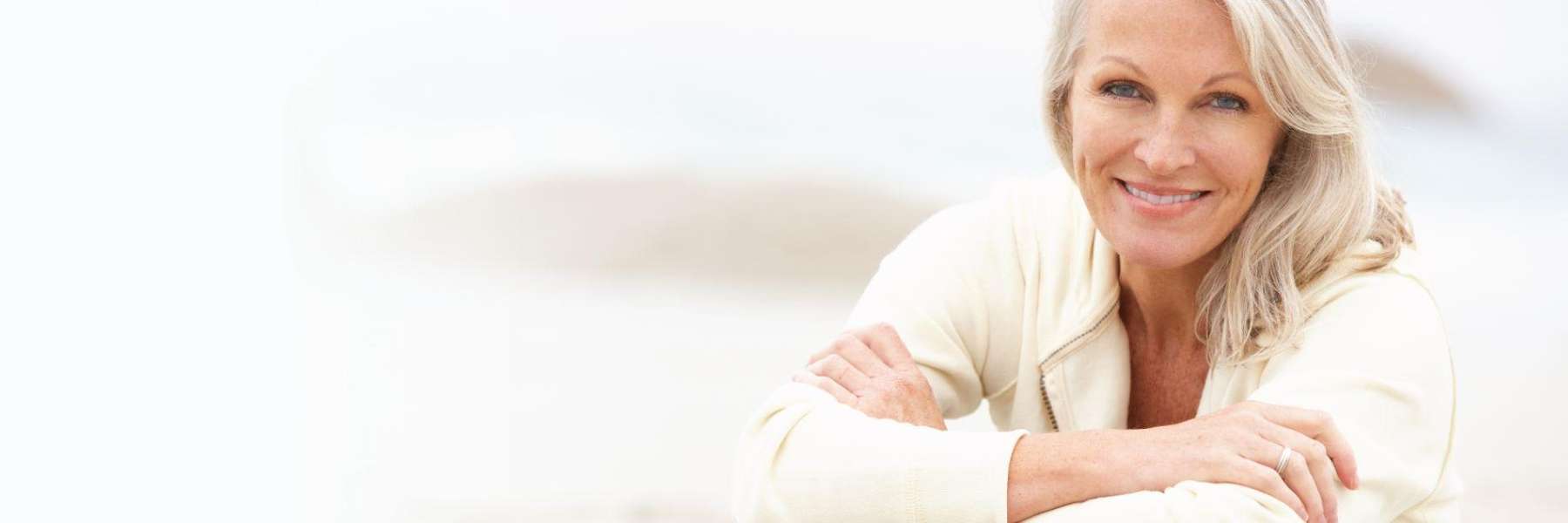 White haired woman in Fayetteville smiling with her white teeth